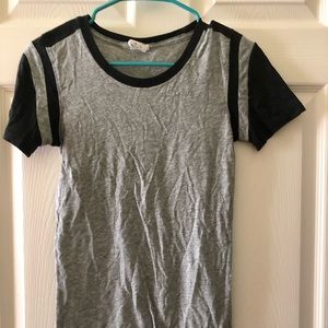 grey shirt with black detailing